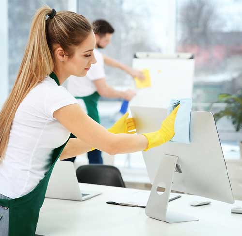 Professional office cleaners ensuring spotless workspace